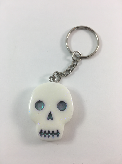 White Spooky Halloween Skull with Black Pearl Eyes Keychain